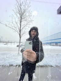 a man is taking a selfie in the snow
