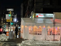 a white tent on a snowy street